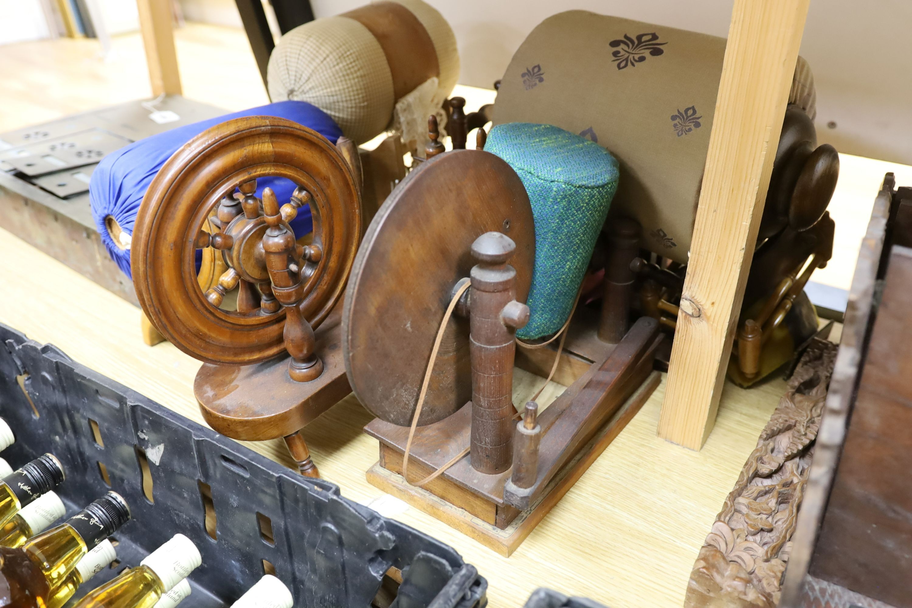 Two model spinning wheels, lace-maker’s pillows, bobbins, pillows etc